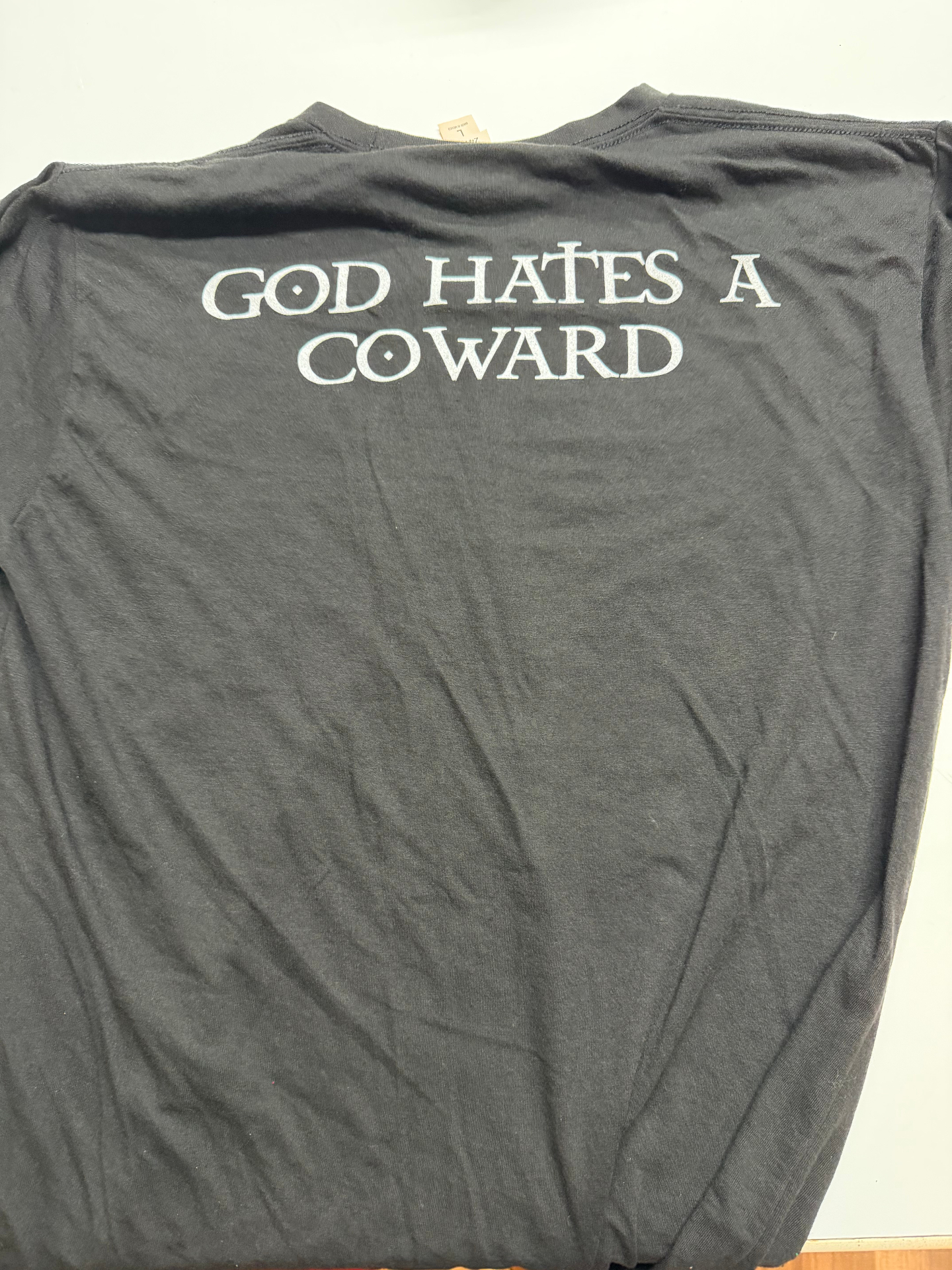 "God Hates A Coward" Tee — White Ink (back)
