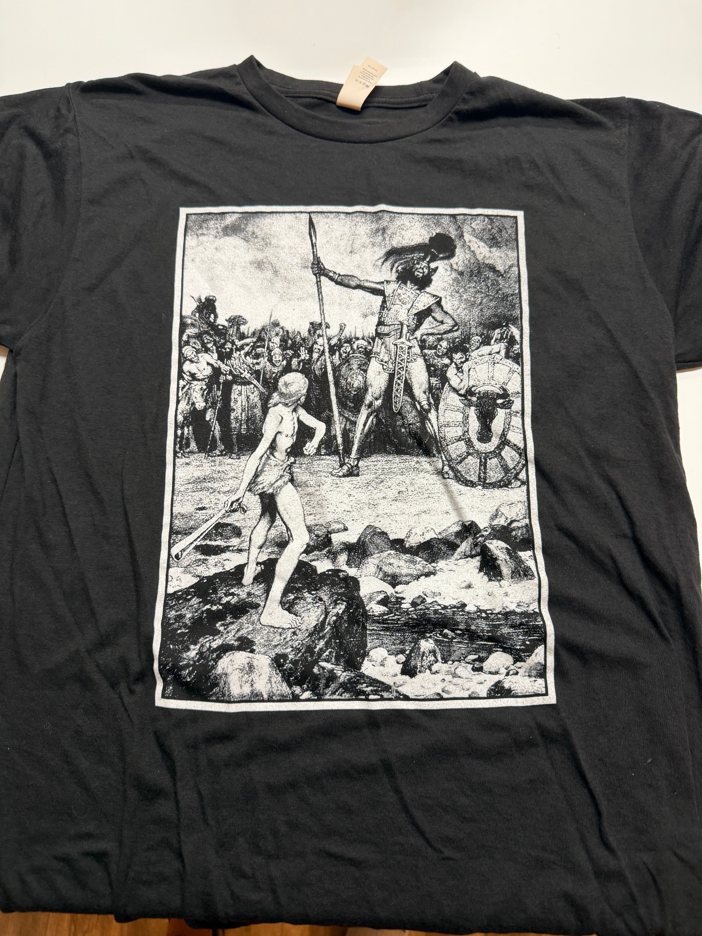 "God Hates A Coward" Tee — White Ink (front)